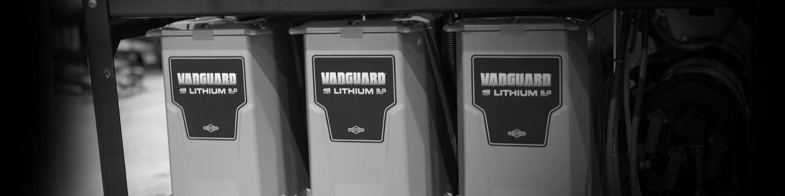 Three Vanguard 48-volt, 5 kilowatt-hour lithium-ion battery packs mounted side by side in a metal rack.