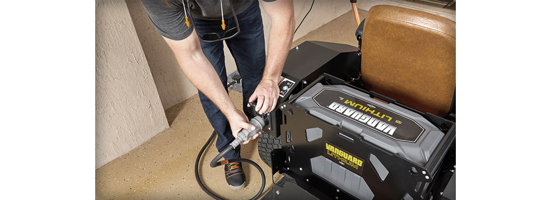  A lithium-ion battery powered commercial lawn mower being charged.