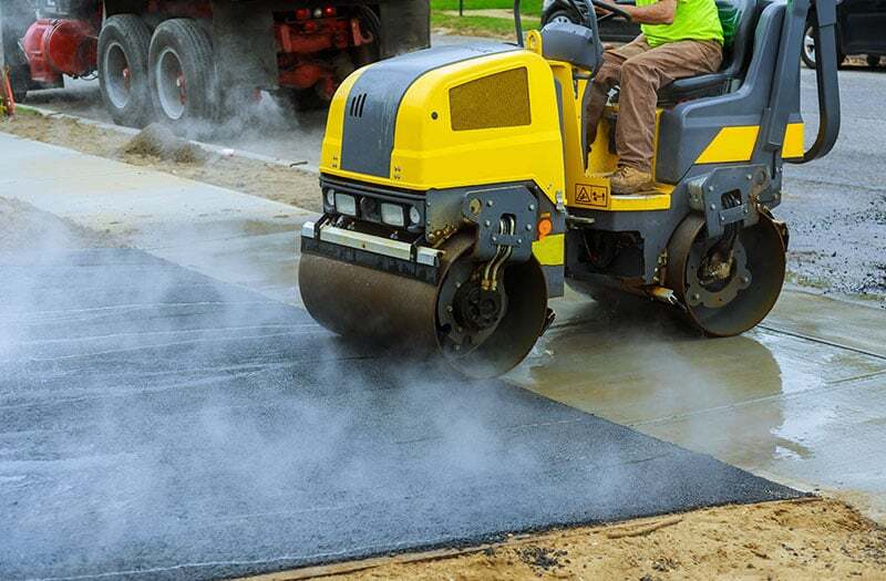 Construction site with pavement equipment